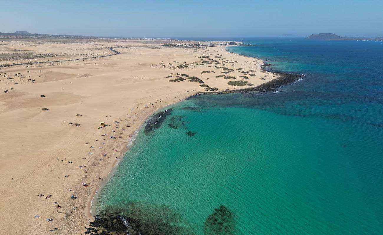 Фото Playa del Dormidero с светлый песок поверхностью