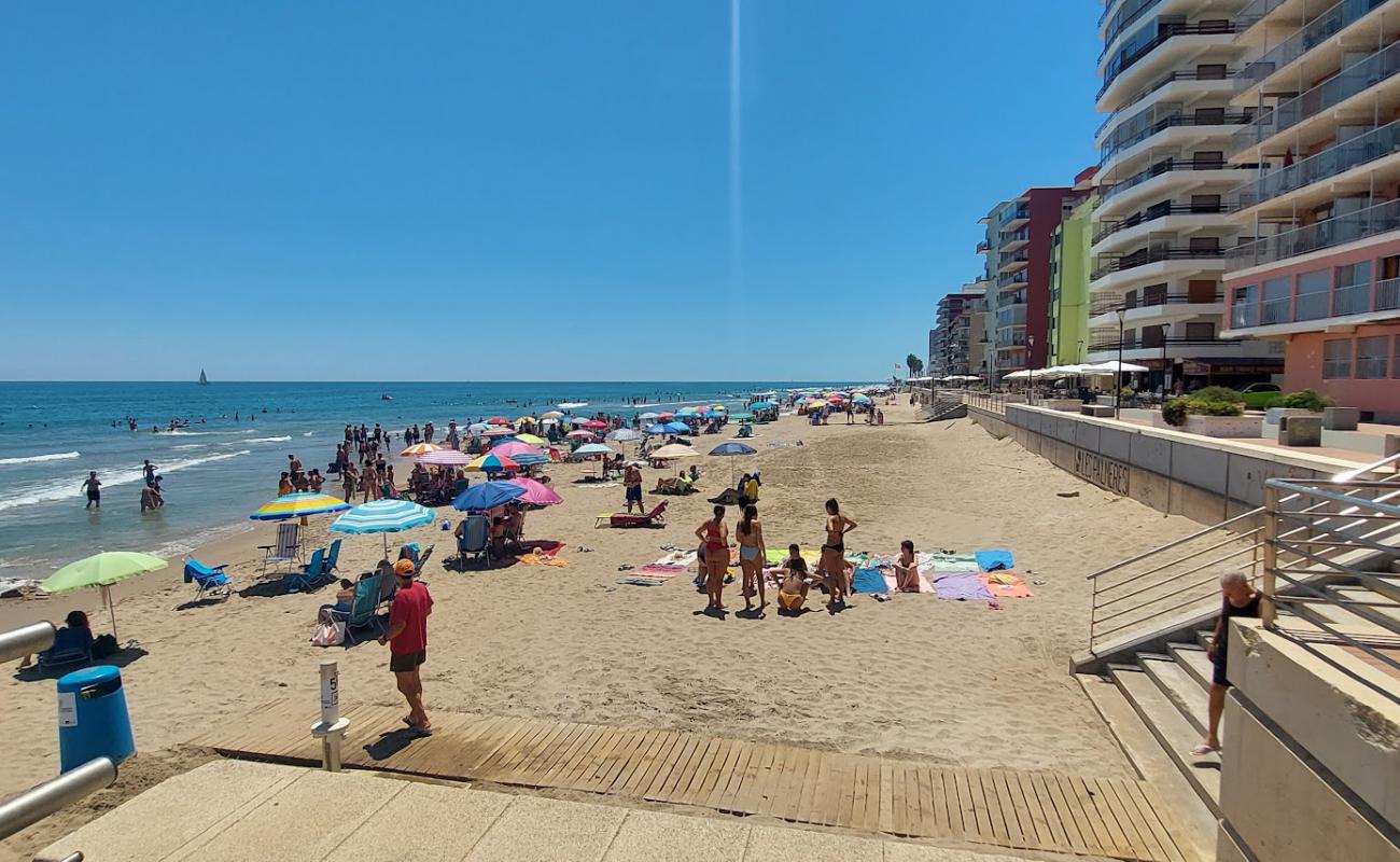 Фото Platja les Palmeres с светлый песок поверхностью