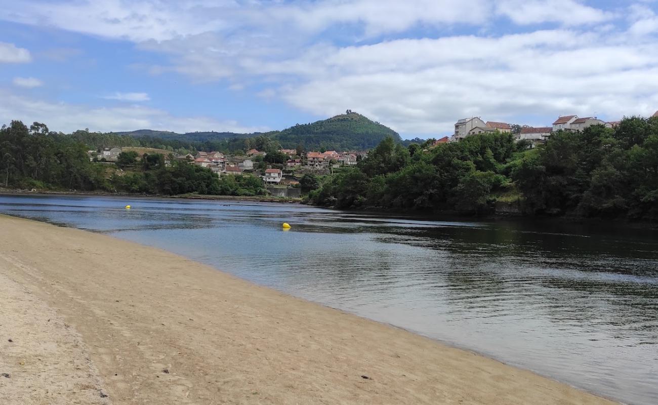 Фото Praia da Xunqueira с светлый песок поверхностью