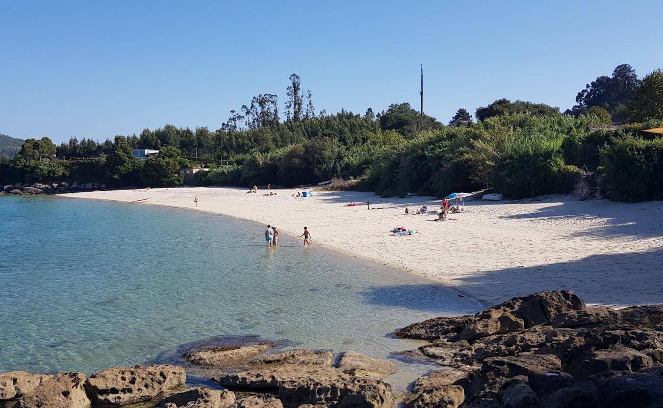 Фото Praia de Pintens с светлый песок поверхностью