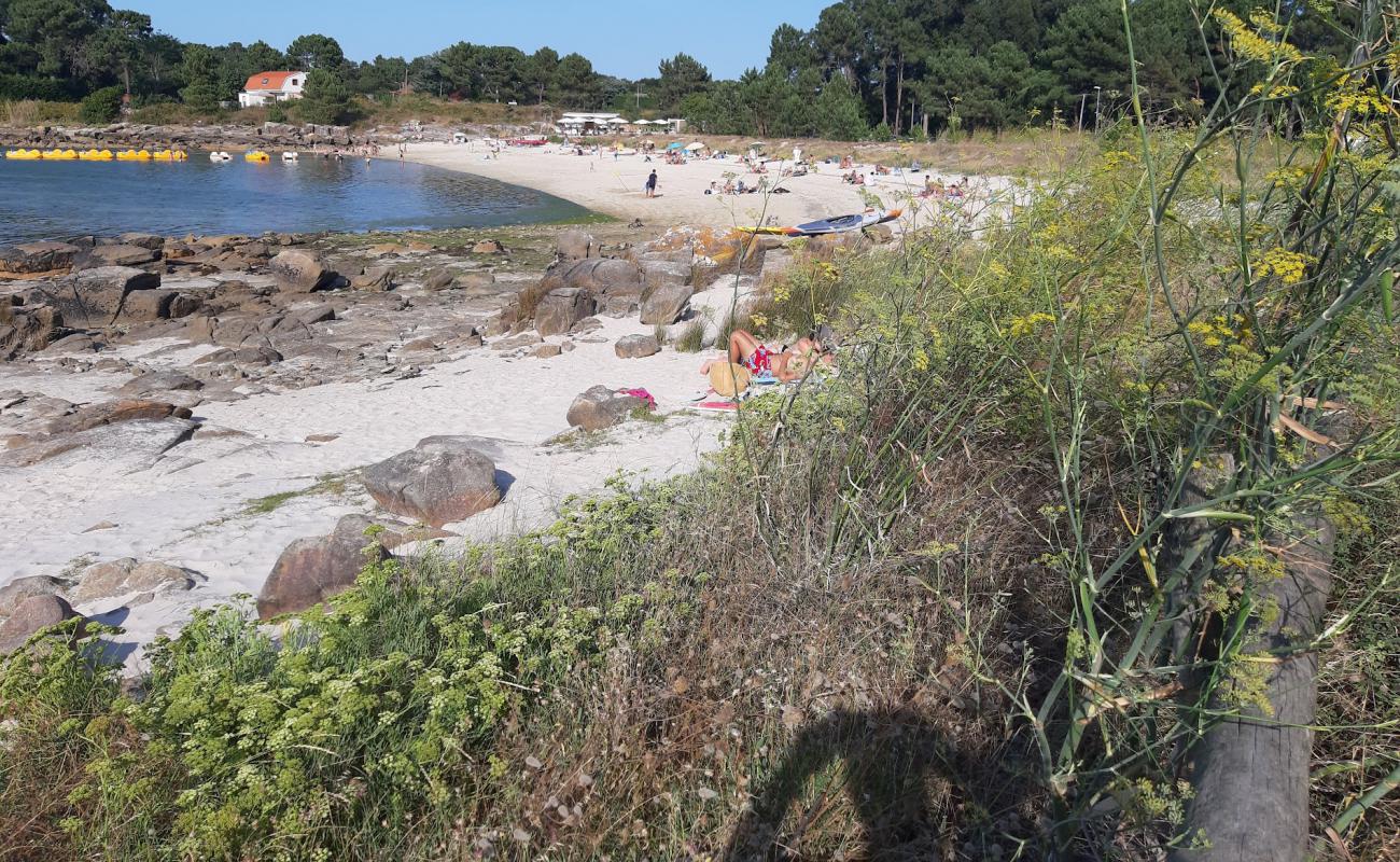 Фото Praia Espineiro с светлый песок поверхностью