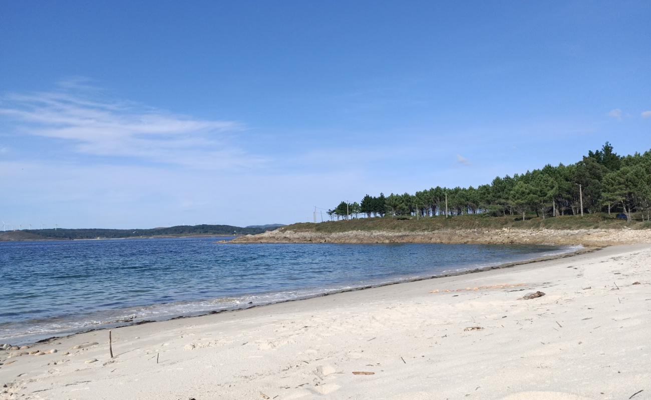 Фото Praia Espineirido с светлый песок поверхностью