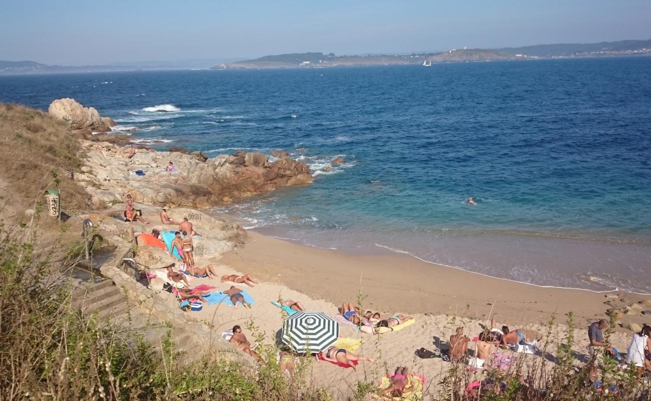 Фото Praia dos Mouros с светлый песок поверхностью