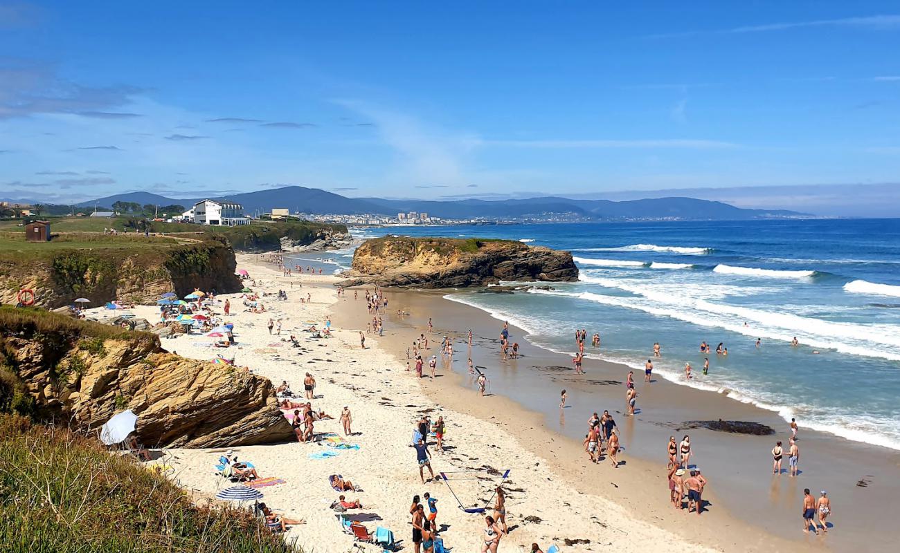 Фото Praia de Fontela с светлый песок поверхностью