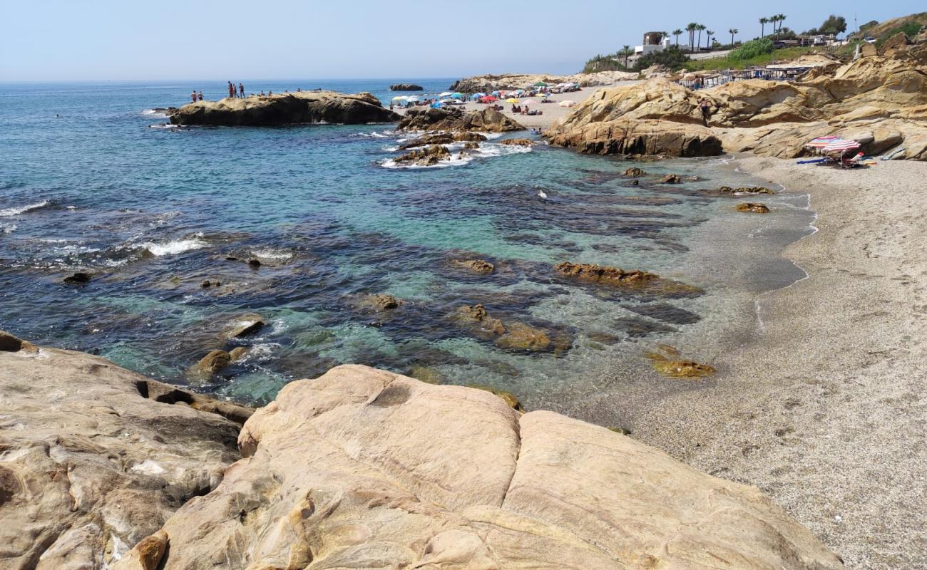 Фото Playa de Chullera с белая чистая галька поверхностью