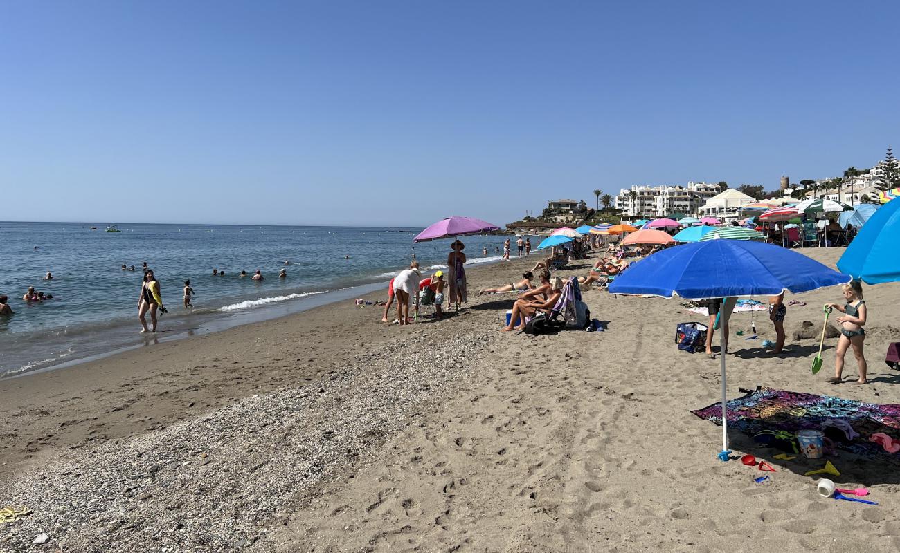 Фото Playa El Bombo с светлый песок поверхностью