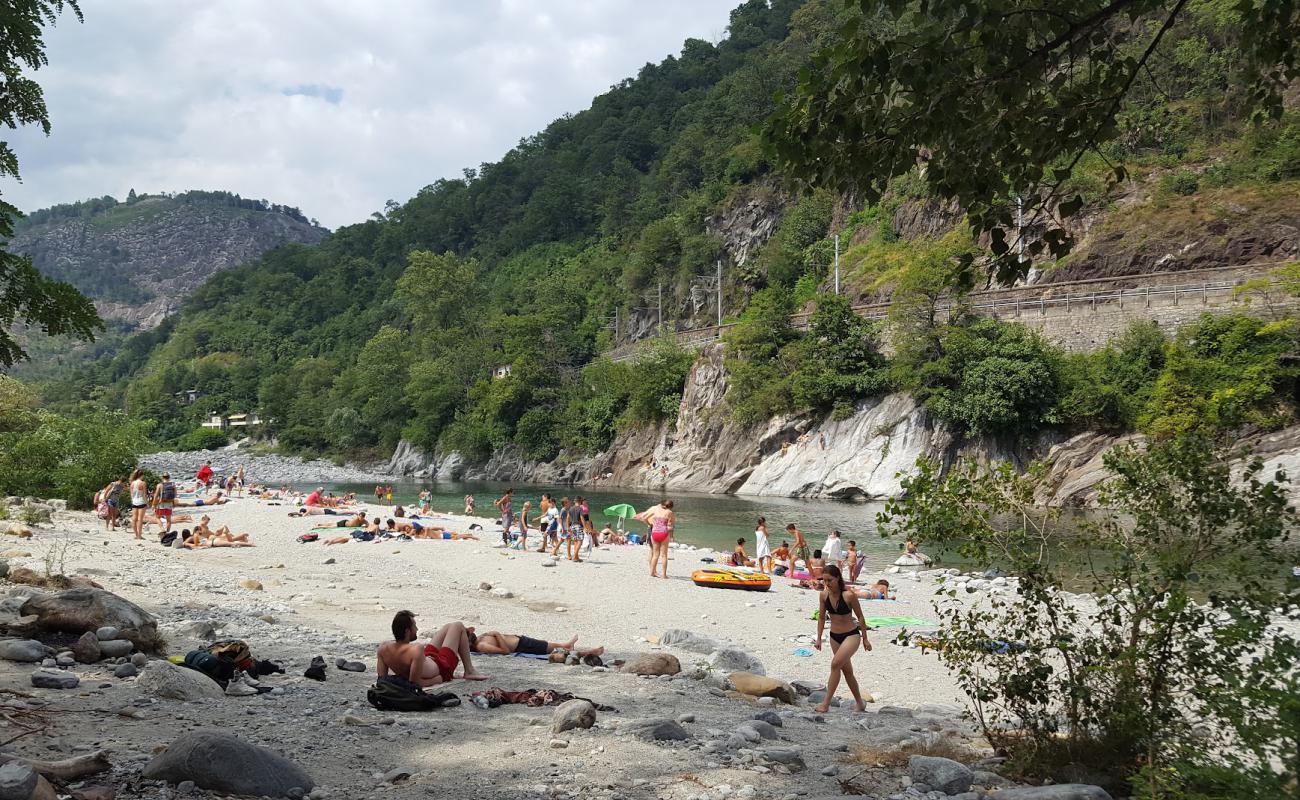 Фото Spiaggia del Meriggio el Merisg с песок с камнями поверхностью