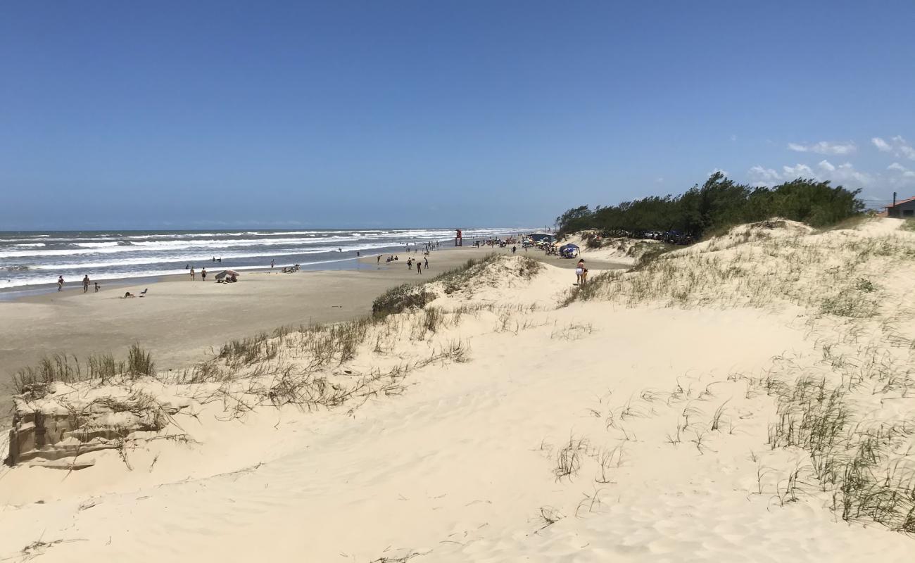 Фото Praia Santa Teresinha с золотистый песок поверхностью