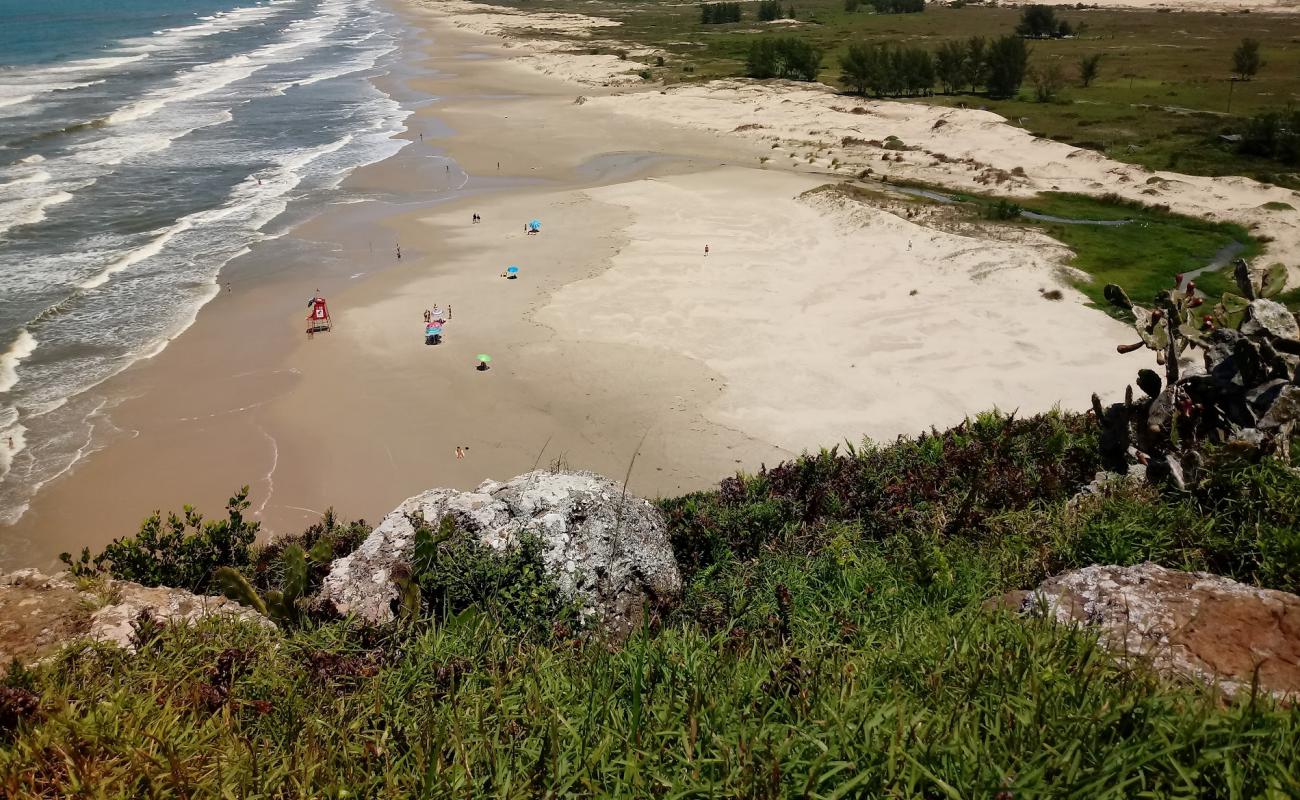 Фото Praia Arroio Seco с золотистый песок поверхностью