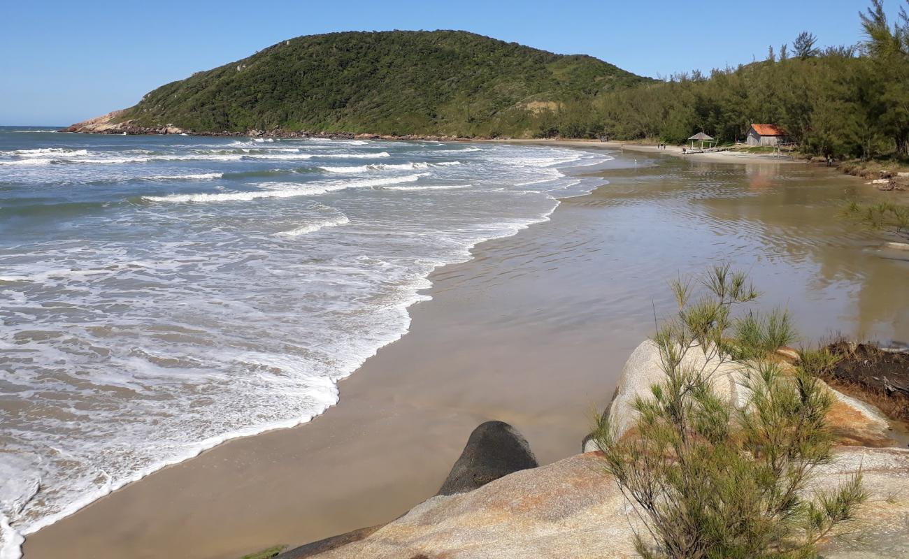 Фото Praia do Vermelha с золотистый песок поверхностью