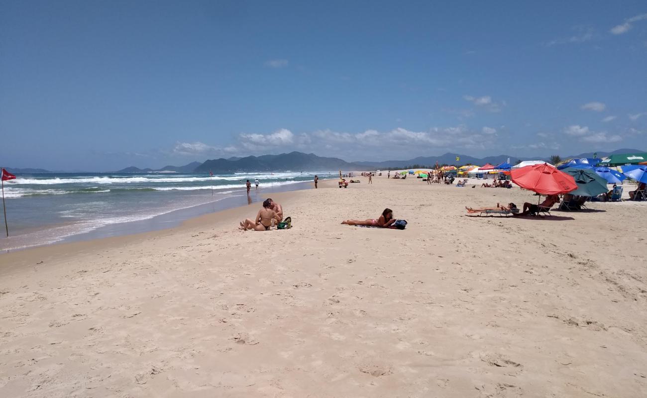 Фото Praia da Guarda с золотистый песок поверхностью