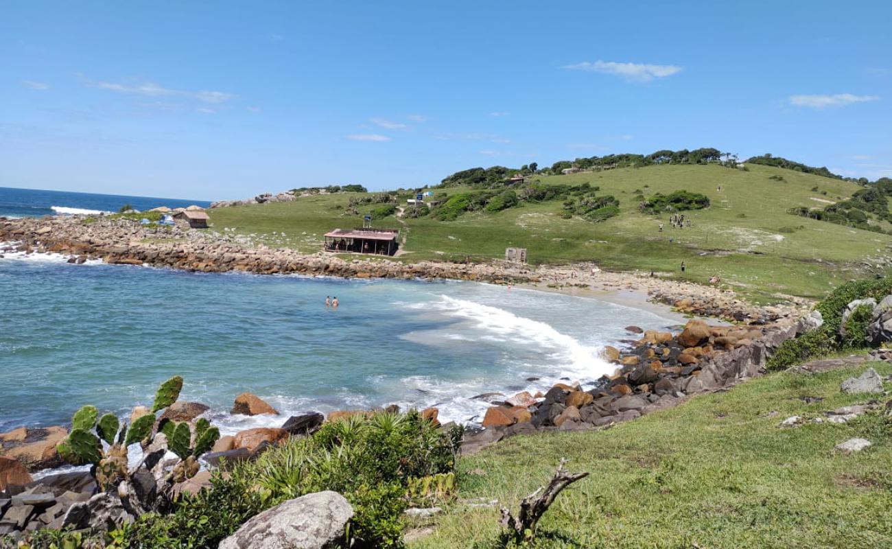 Фото Praia do Maso с светлый песок поверхностью