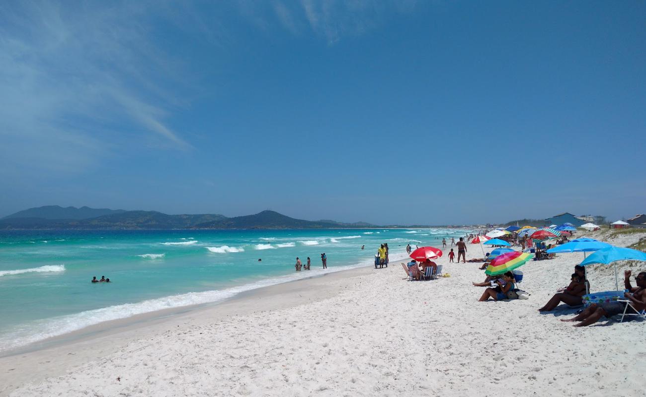 Фото Praia do Foguete с белый чистый песок поверхностью