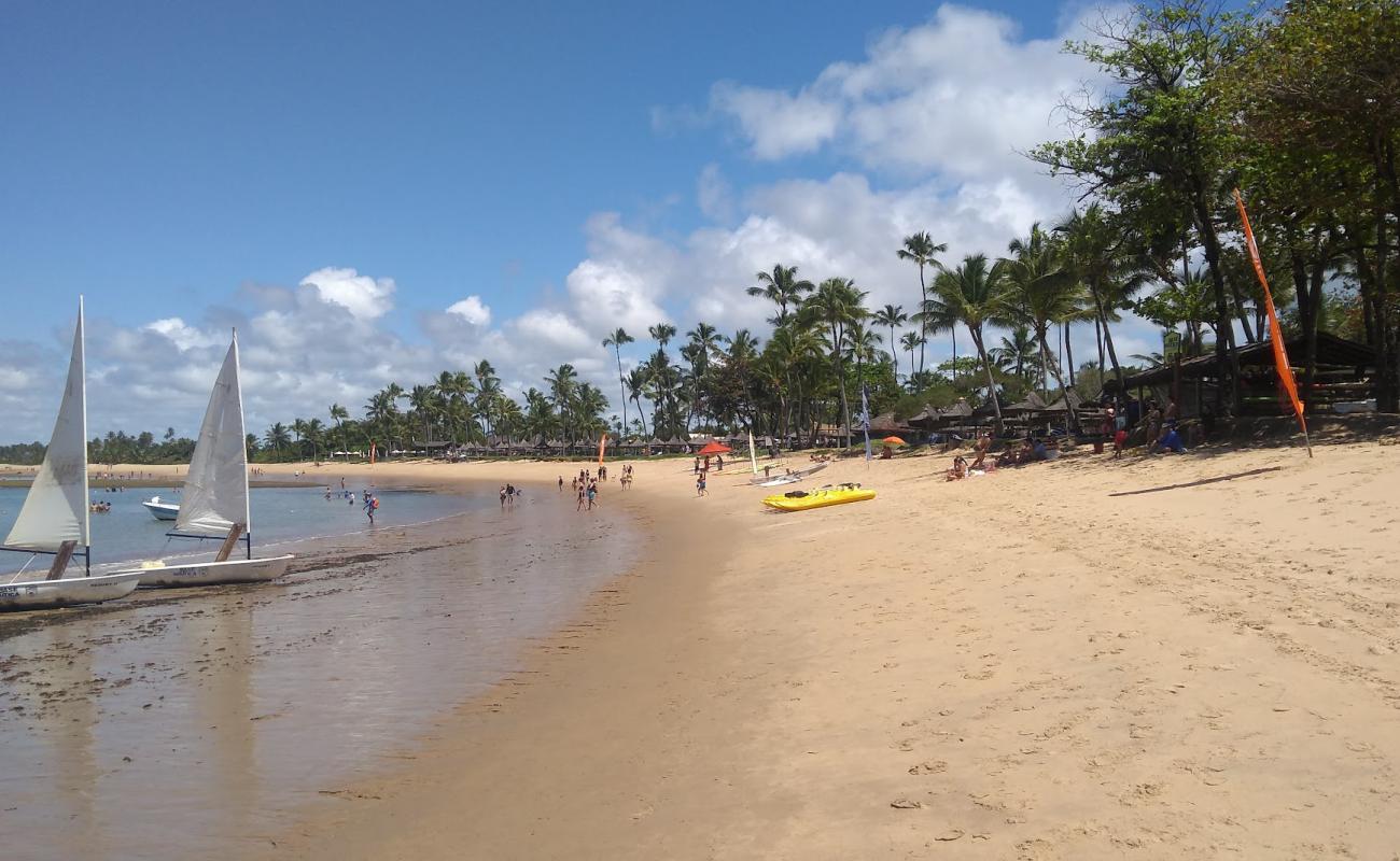 Фото Praia do Tivoli с светлый песок поверхностью