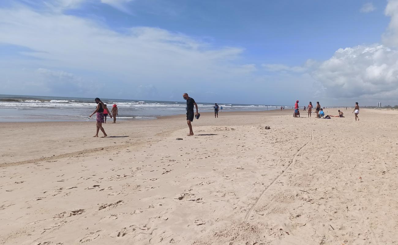 Фото Praia de Aruana с золотистый песок поверхностью