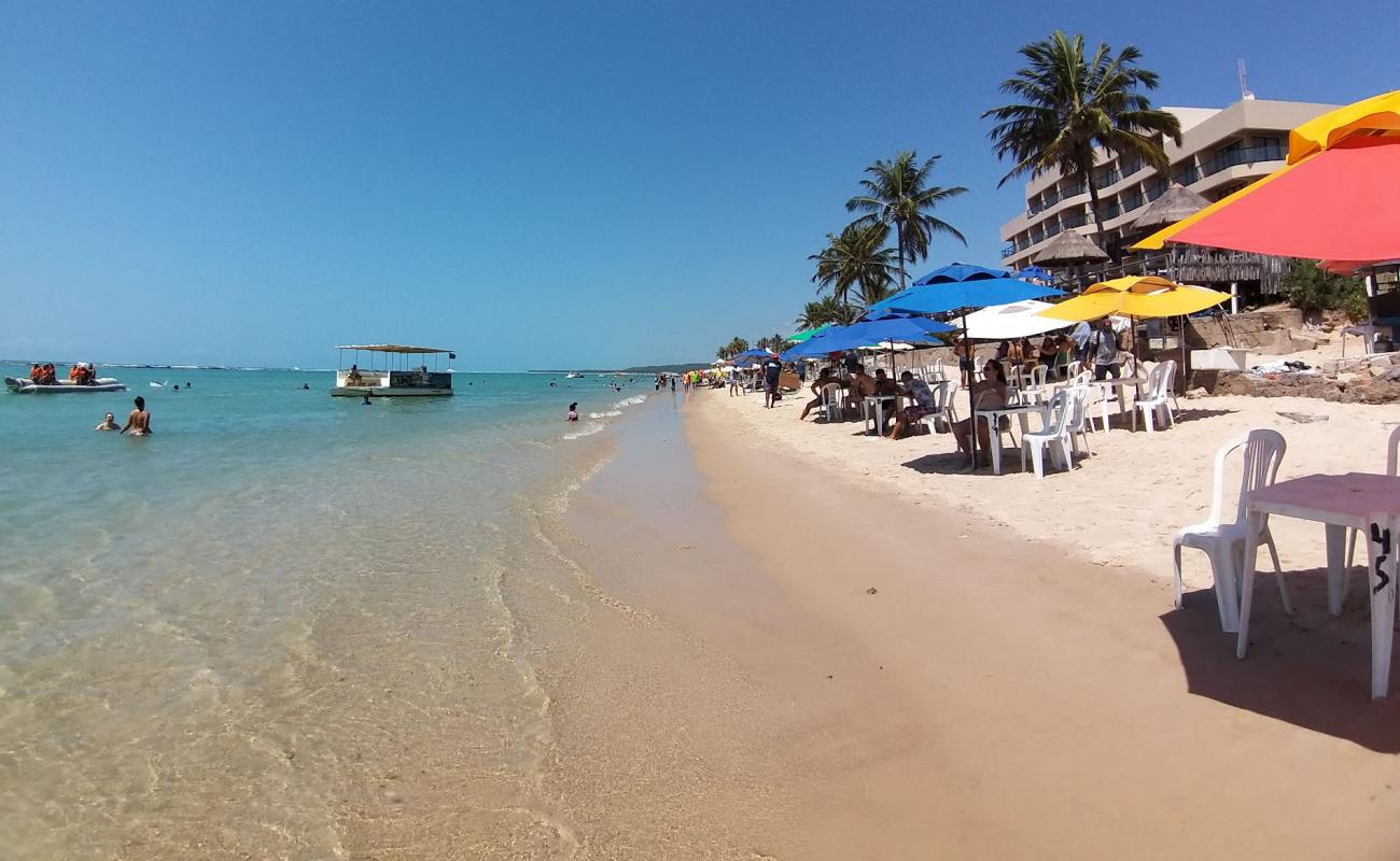 Фото Praia Niquim с светлый песок поверхностью