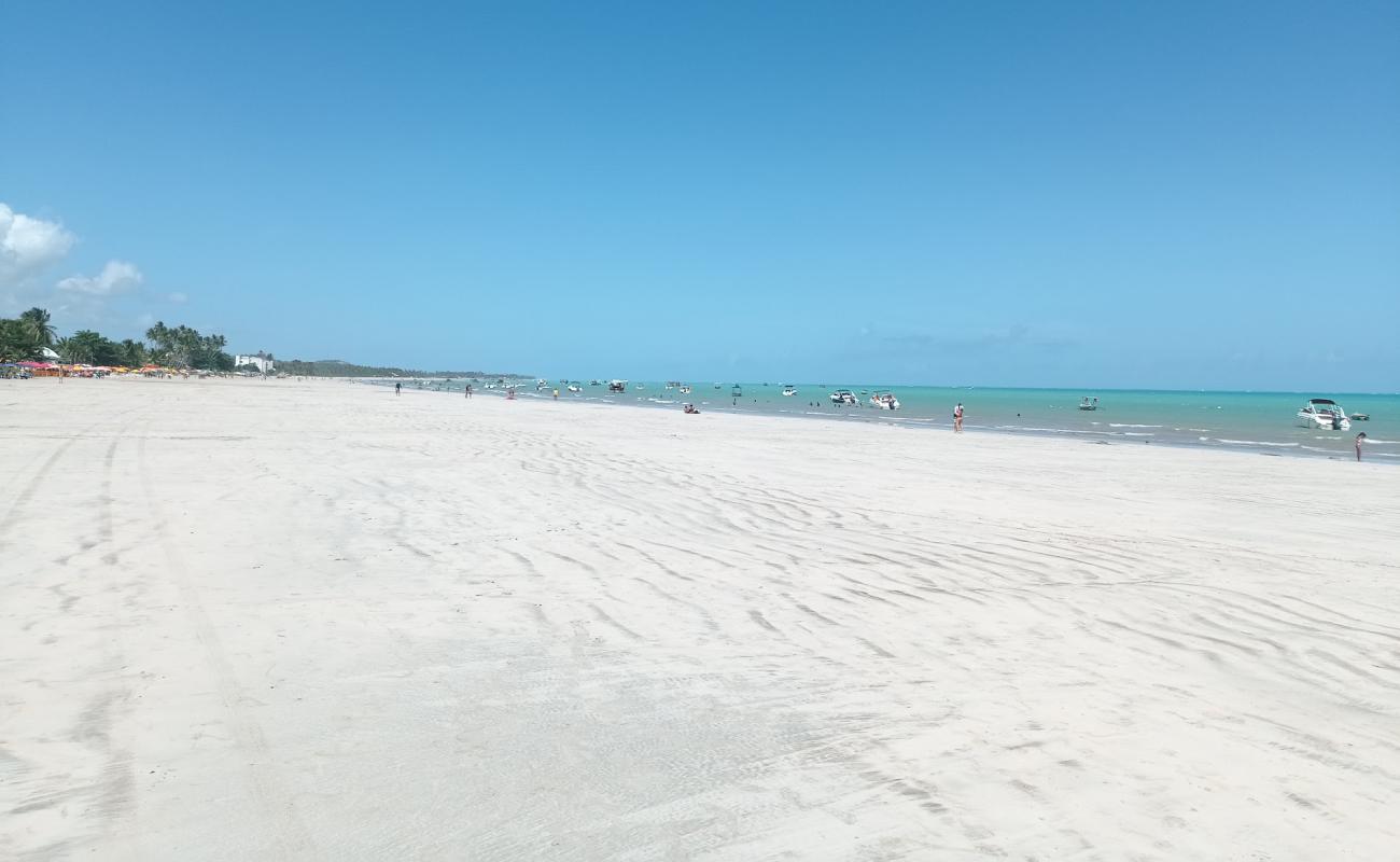 Фото Praia dos Casais с светлый песок поверхностью