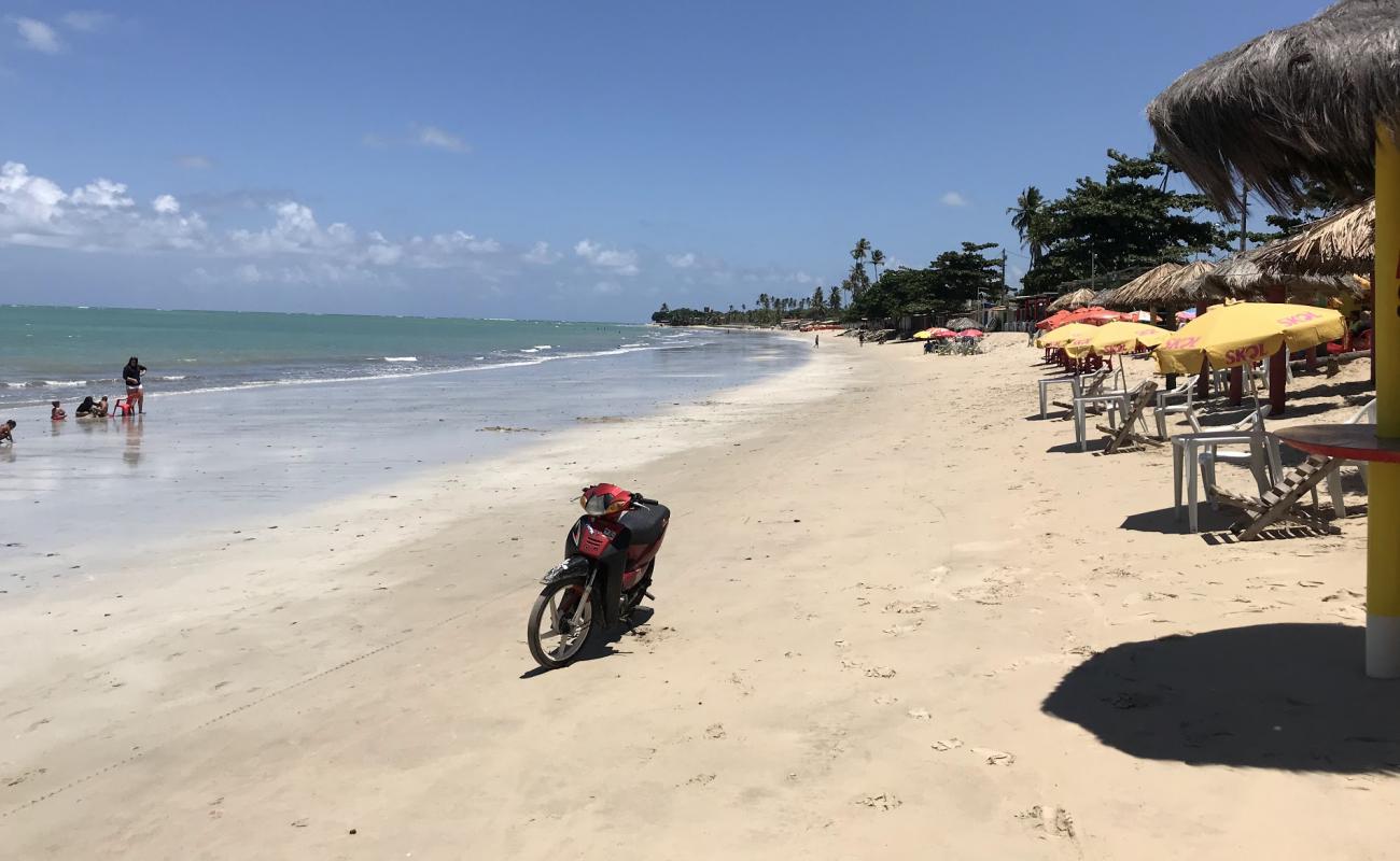 Фото Praia da Conceicao с светлый песок поверхностью