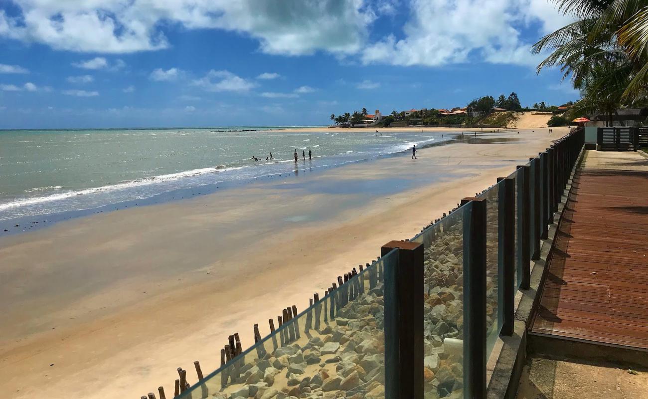 Фото Praia de Porto Mirim с золотистый песок поверхностью