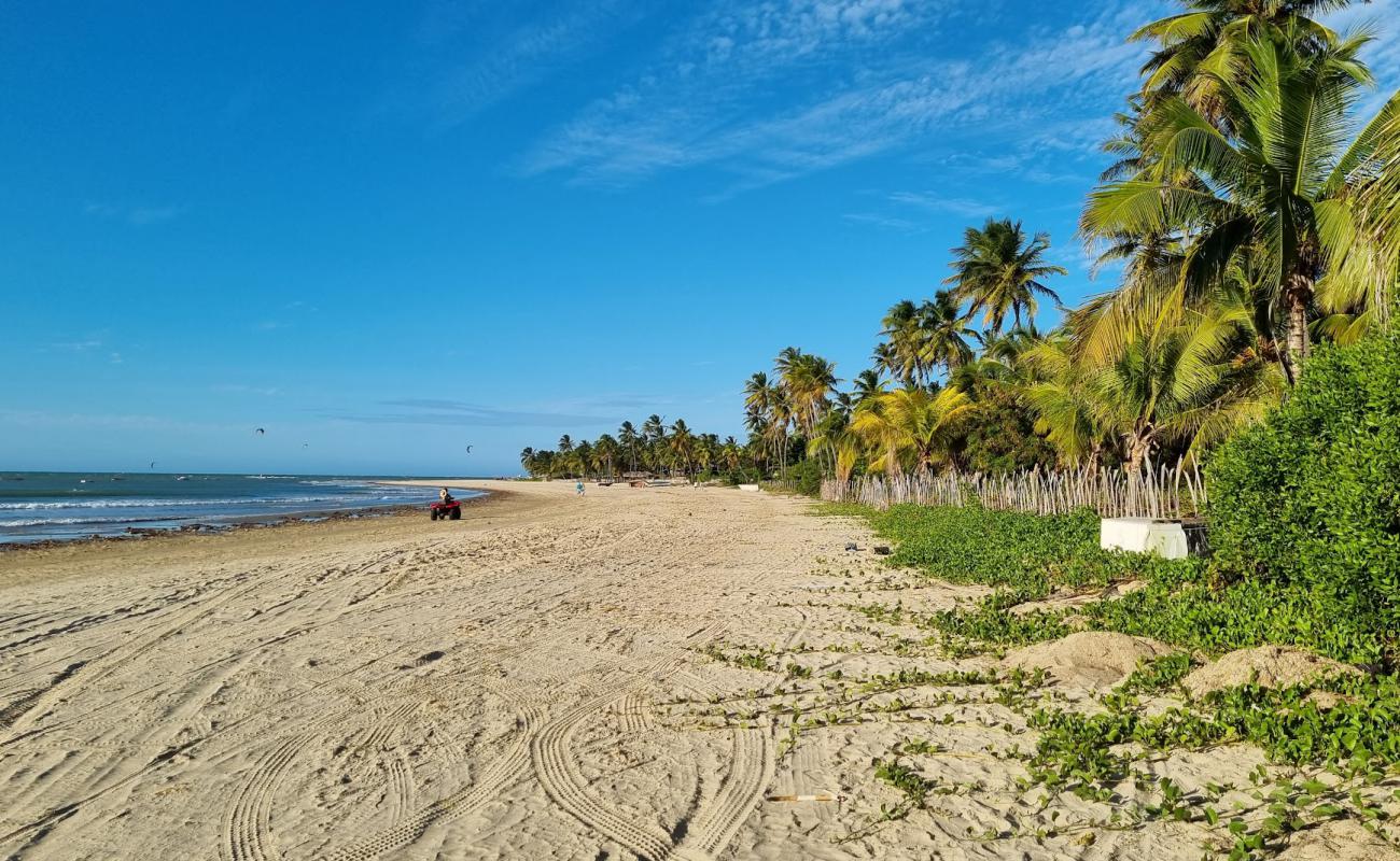 Фото Praia de Amontada с светлый песок поверхностью