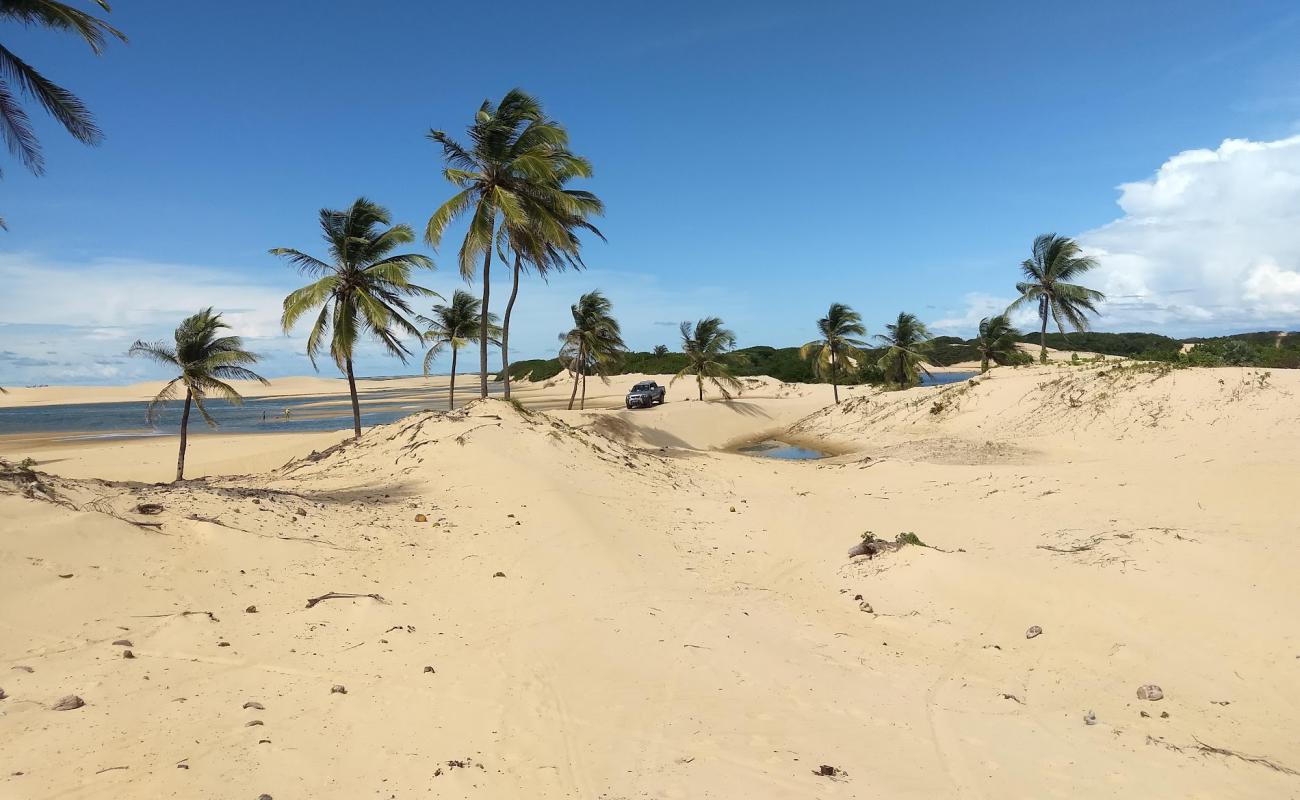 Фото Praia do Amor с светлый песок поверхностью