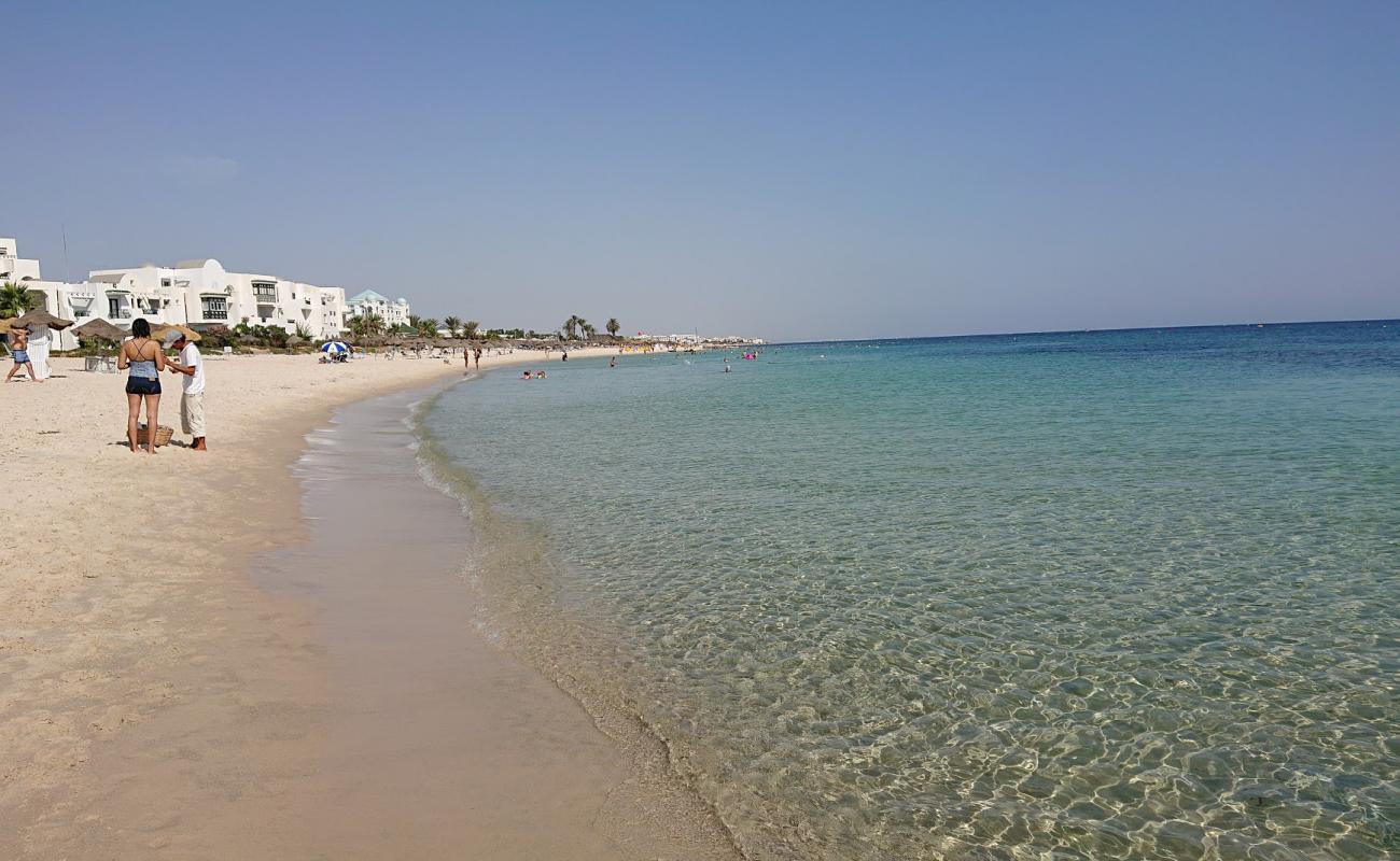 Фото Kaki beach с белый песок поверхностью