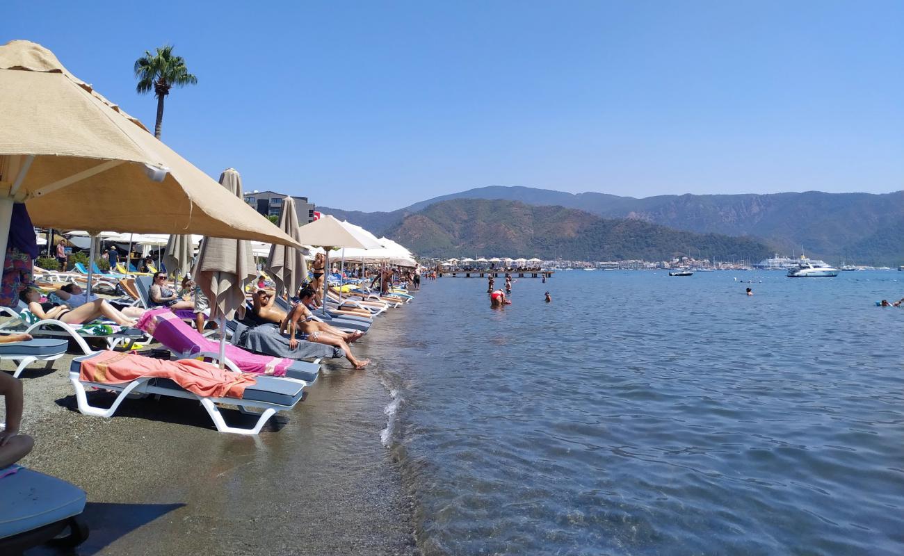 Фото Marmaris Plaji II с светлый песок поверхностью