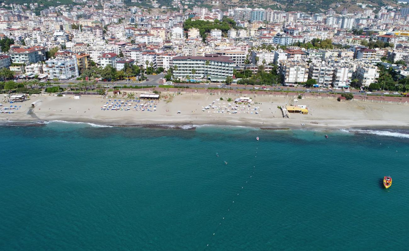 Фото Portakal beach с темный песок поверхностью