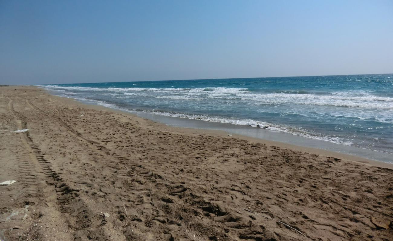 Фото Tasucu beach II с светлый песок поверхностью