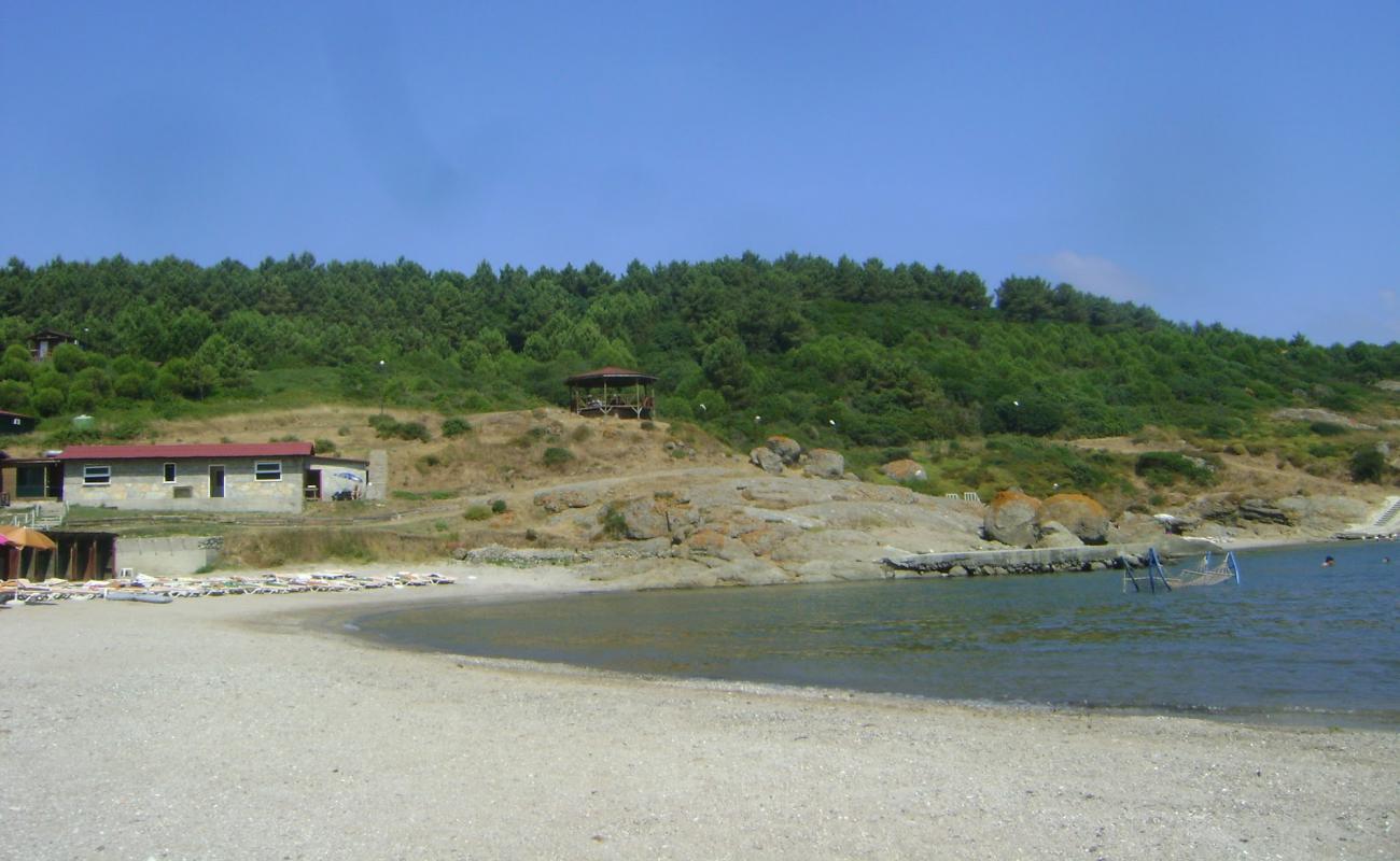 Фото Sebastian beach II с белая чистая галька поверхностью