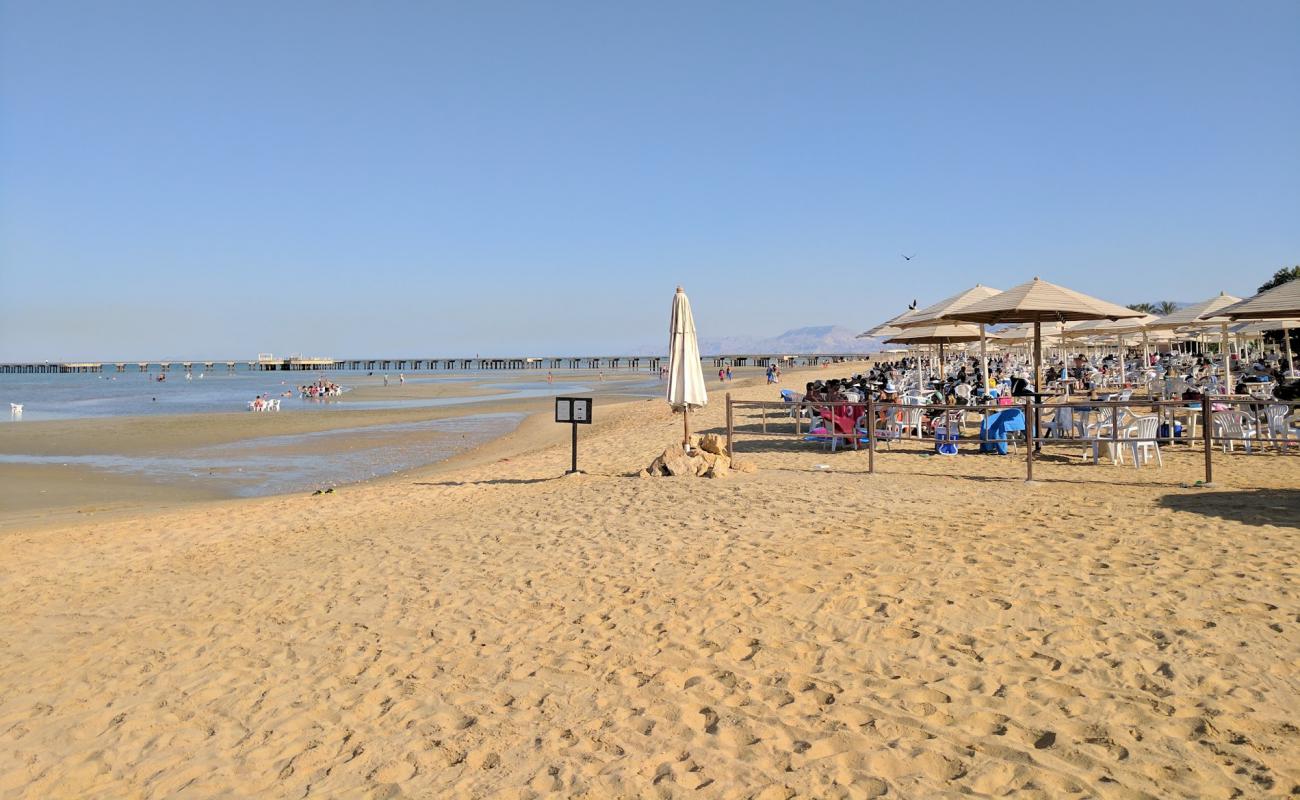 Фото Stella di Mare Beach с светлый песок поверхностью