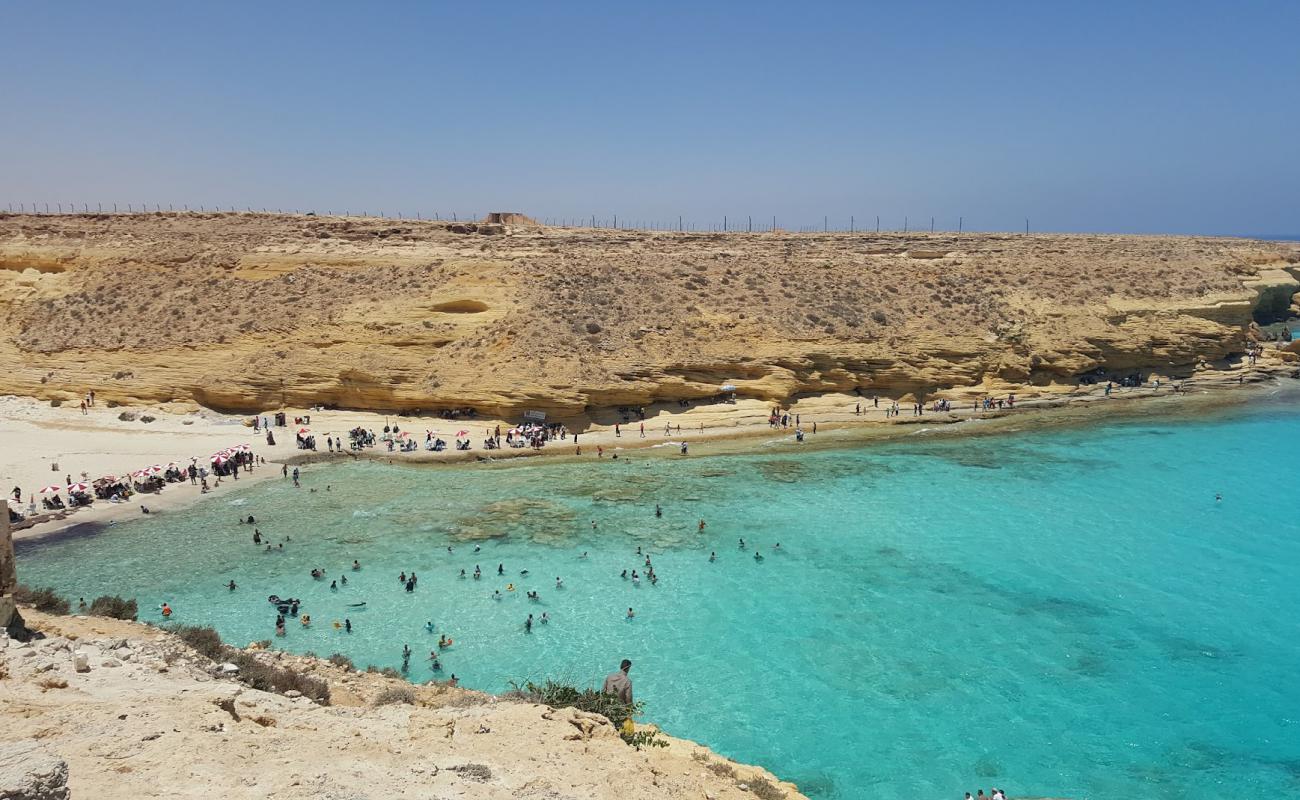 Фото Ageeba Beach с светлый песок поверхностью