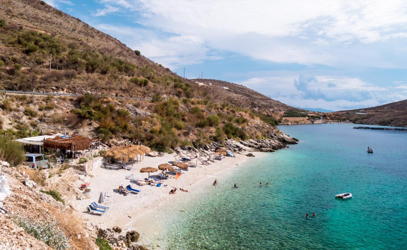 Фото Porto Palermo beach с белая галька поверхностью