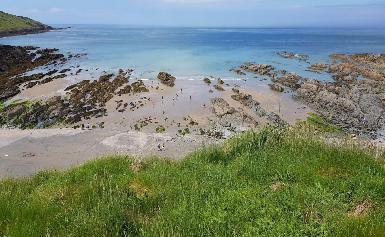 Фото Rockham beach с песок с камнями поверхностью