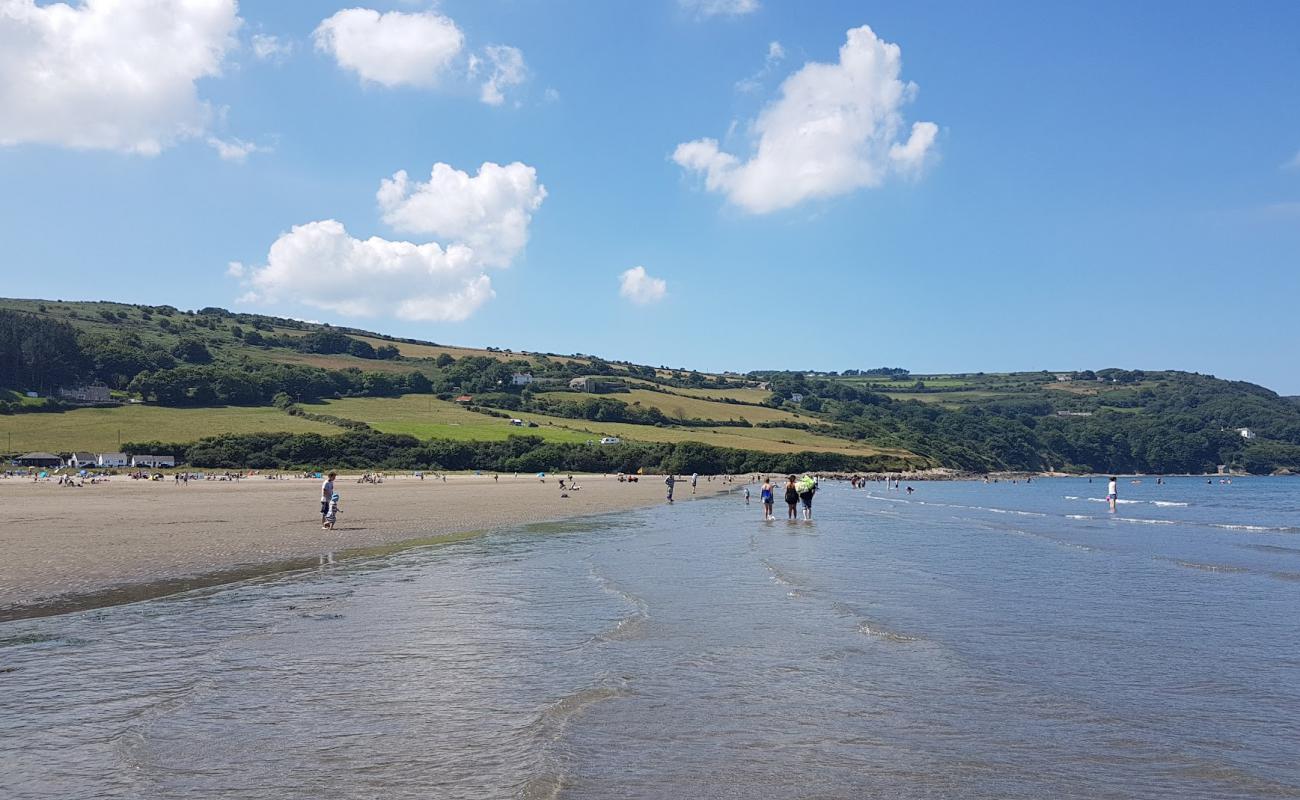 Фото Poppit Sands beach с светлый песок поверхностью