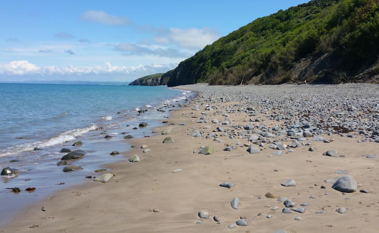 Фото Cei Bach beach с песок с галькой поверхностью