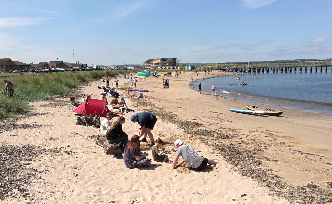 Фото Amble Beach с светлый песок поверхностью