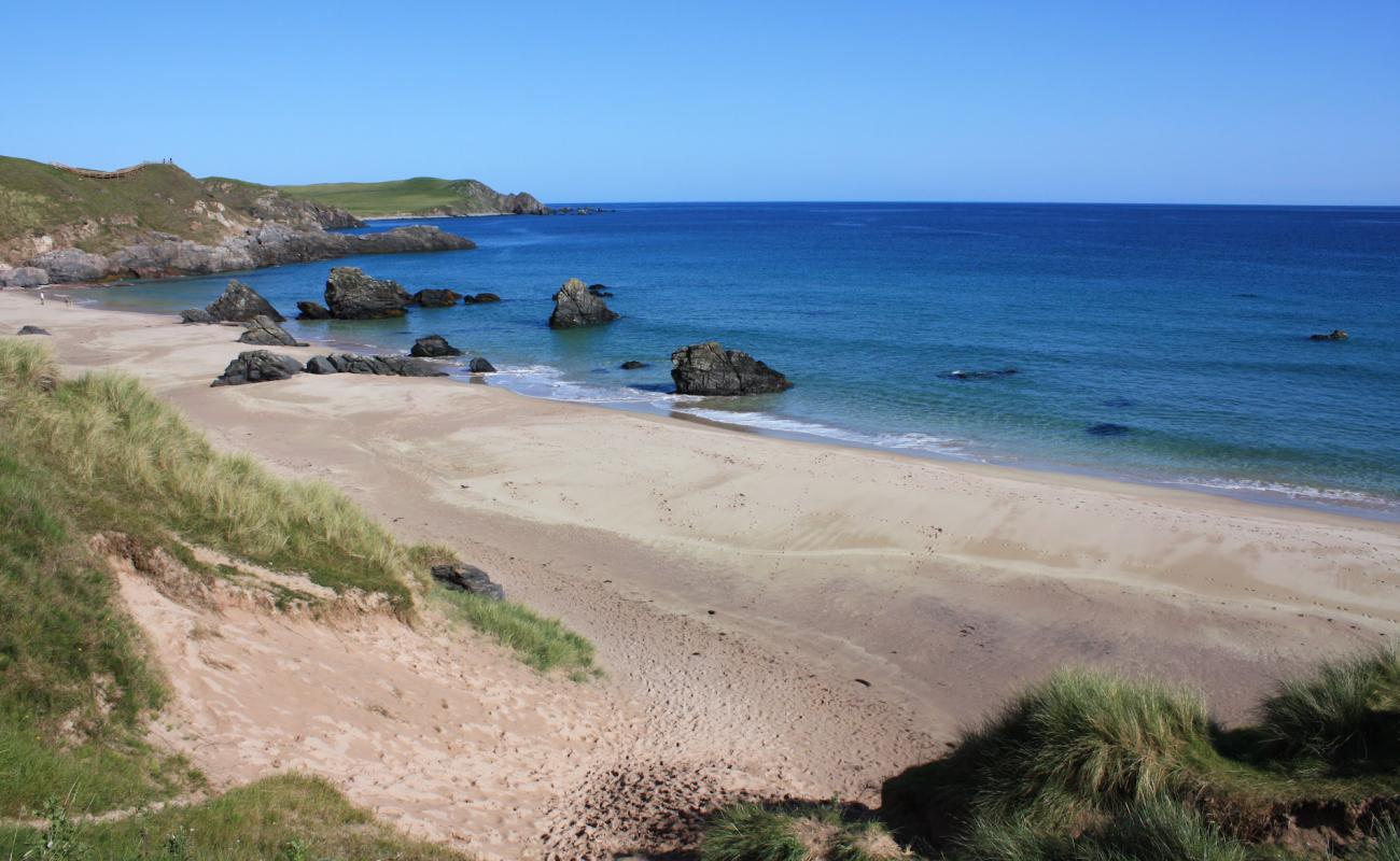 Фото Durness Beach с светлый песок поверхностью