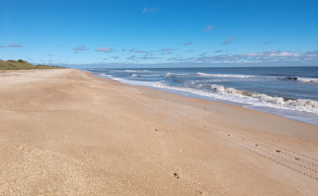 Фото Guana Reserve beach с золотой ракушечник поверхностью