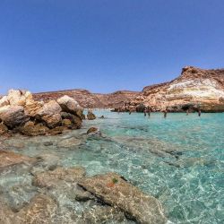 Фото Spiaggia Dei Conigli с кристальная вода поверхностью